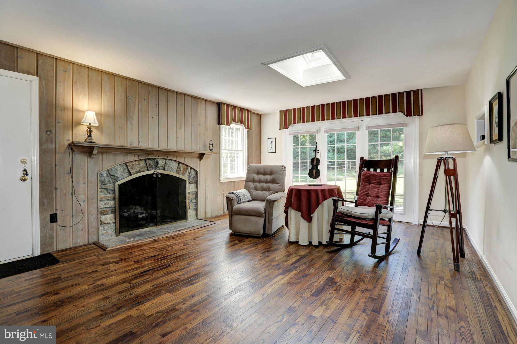 11804 Gregerscroft Road Potomac, MD 20854 - Photo 13 of 23 Den w/ Wood Burning Fireplace