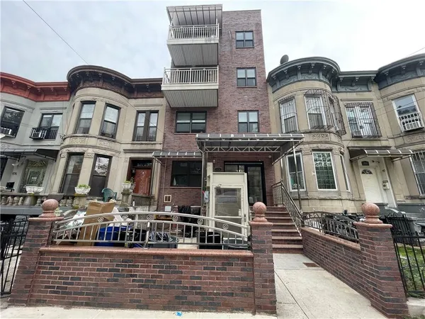 a front view of a multi story residential apartment building