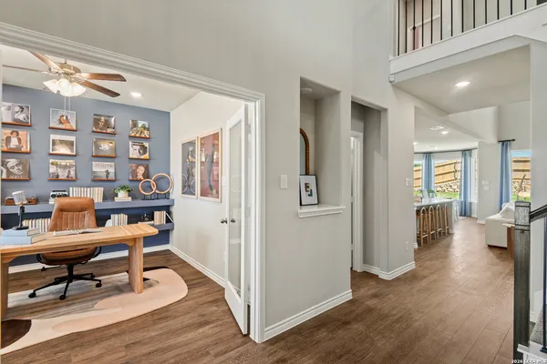 a view of entryway and hall with wooden floor