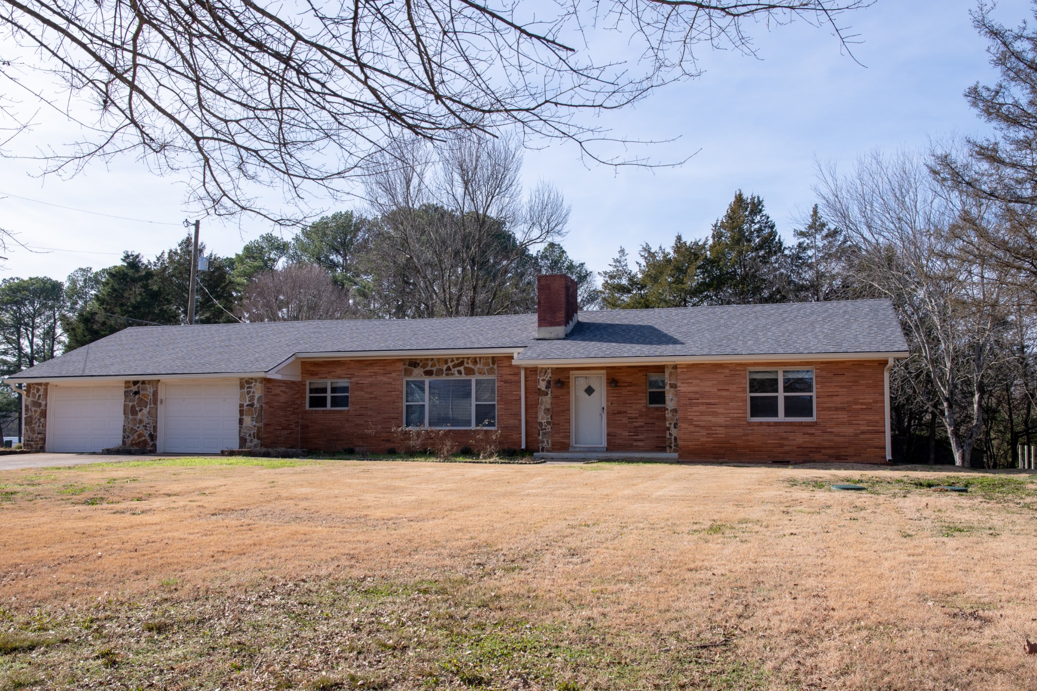 340 Jeff Road Northwest Huntsville, AL 35806 - Photo 1 of 17 a front view of house with yard and trees