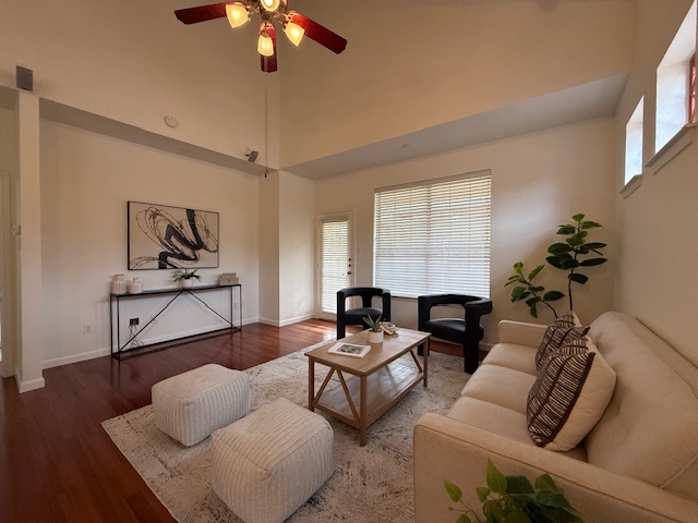 14815 Avery Ranch Boulevard, Unit 19E Austin, TX 78717 - Photo 3 of 4 Living area with wood finished floors, a high ceiling, and a ceiling fan