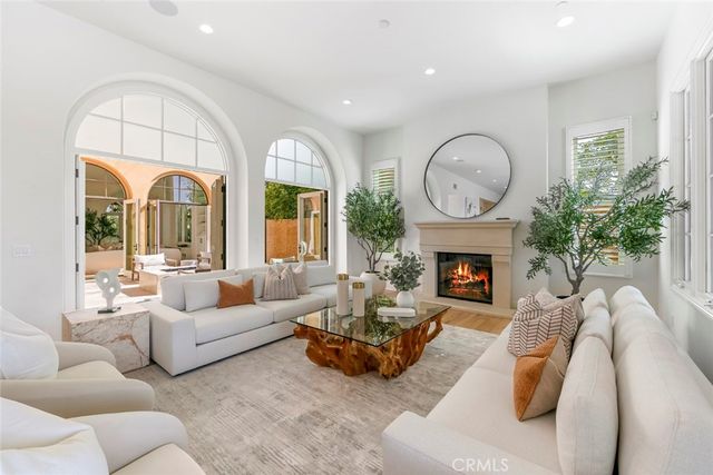 a large white kitchen with a large window