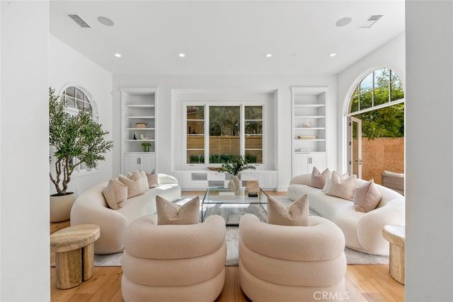 a view of hallway with wooden floor and staircase