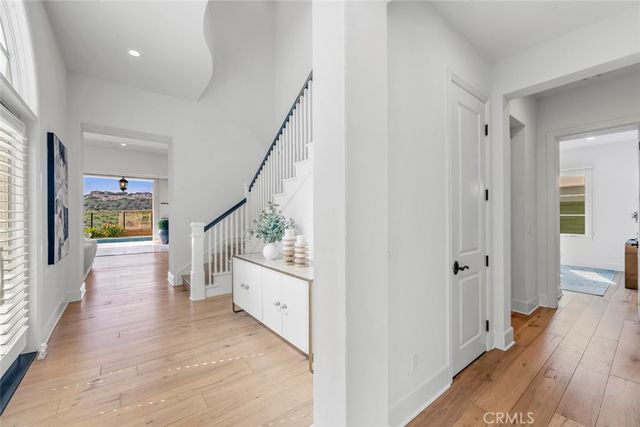 a living room with fireplace furniture and a large window