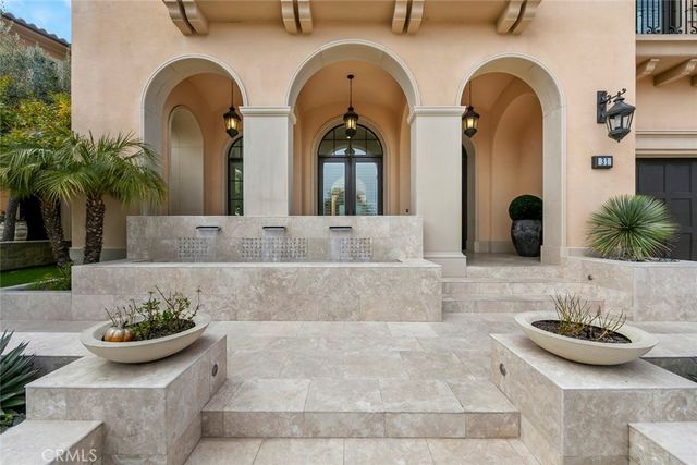a view of a porch with furniture and a yard