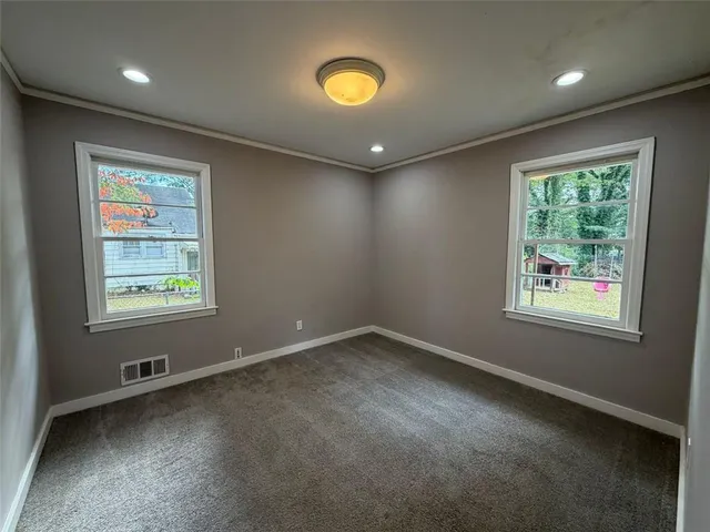 an empty room with windows