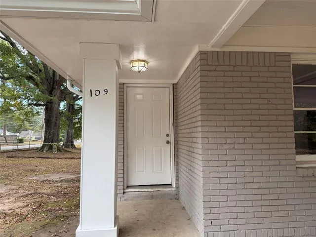a view of a door and a house