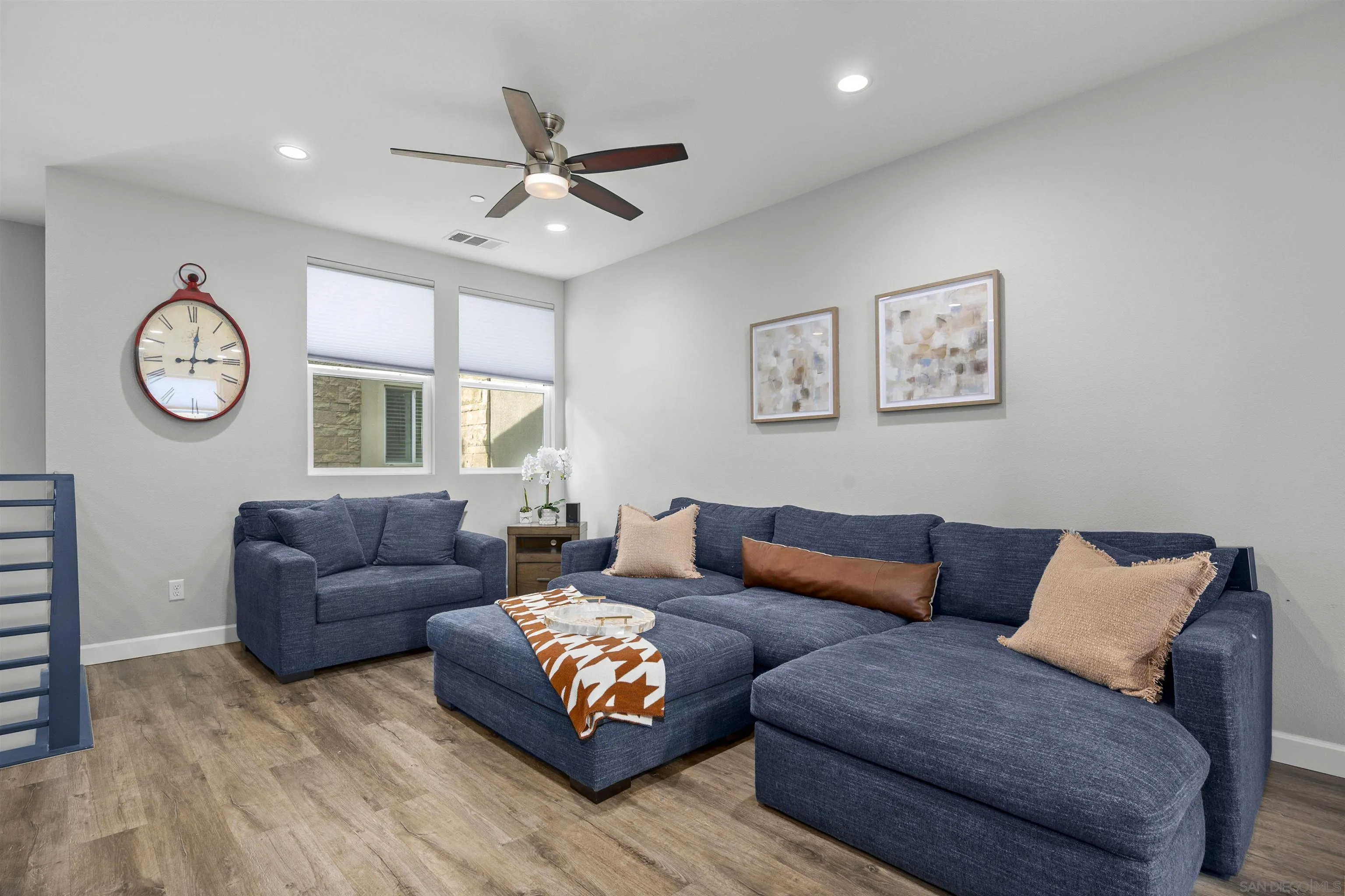 7834 Inception Way San Diego, CA 92108 - Photo 11 of 62 a living room with furniture a clock and a window