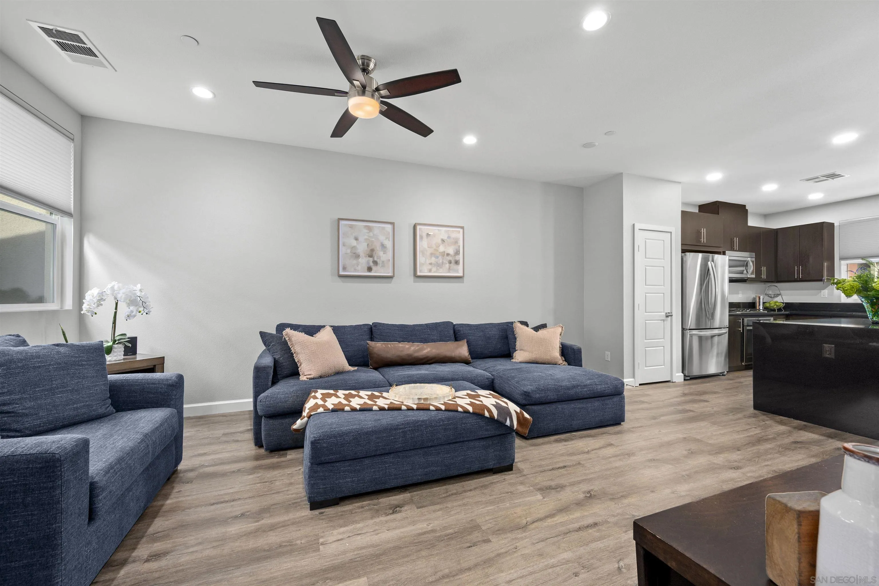 7834 Inception Way San Diego, CA 92108 - Photo 12 of 62 a living room with furniture and kitchen view