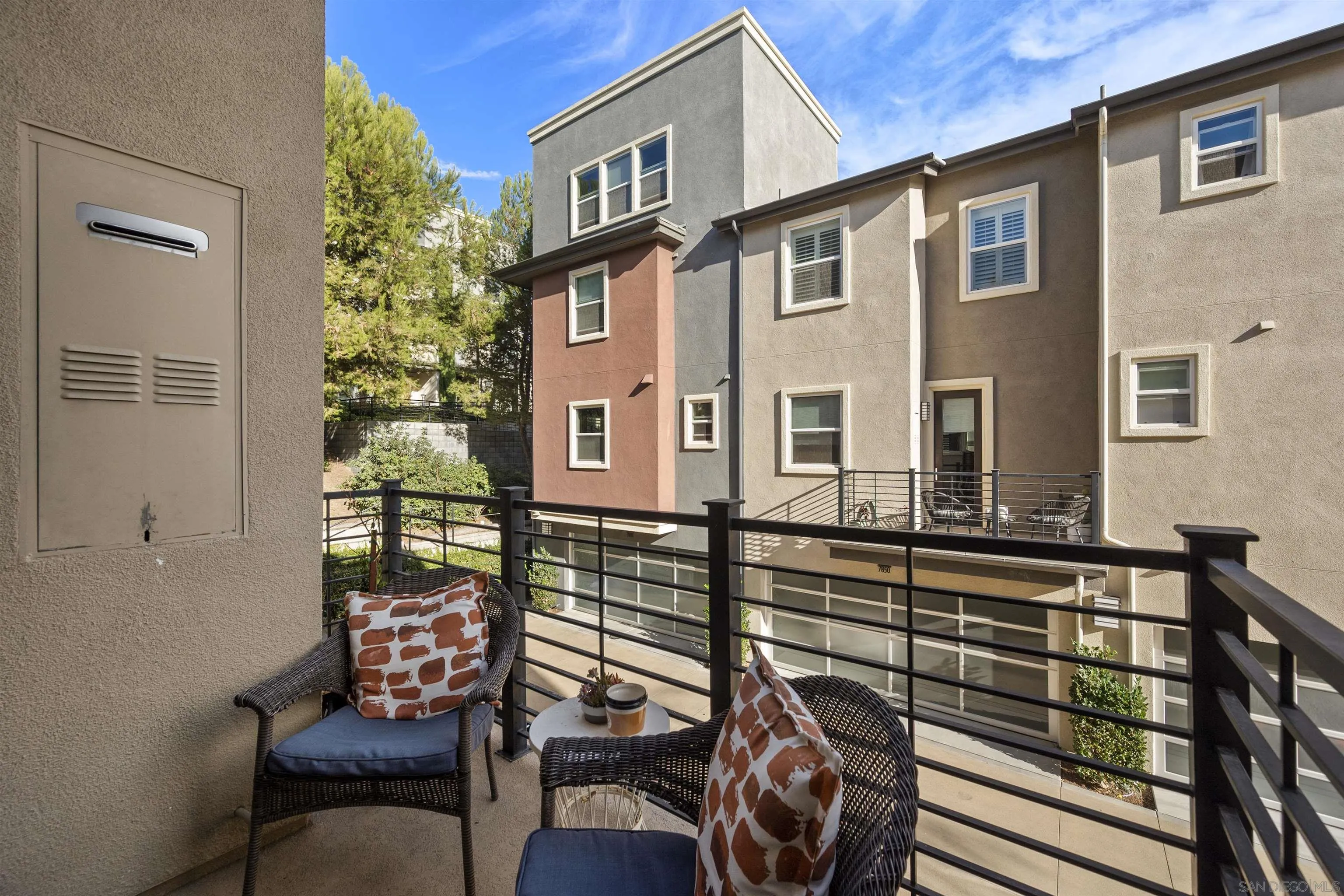 7834 Inception Way San Diego, CA 92108 - Photo 17 of 62 a front view of a house with outdoor seating