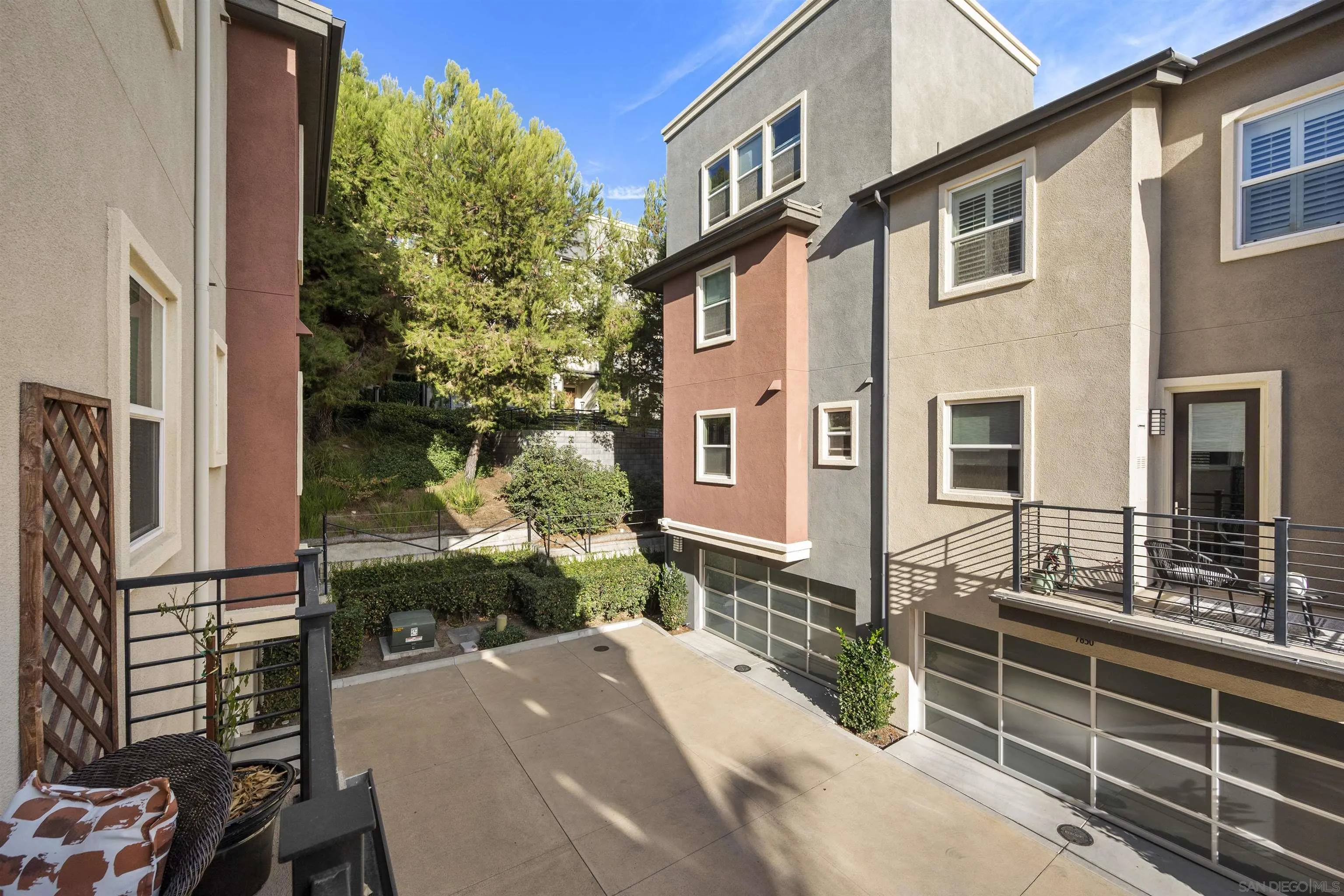 7834 Inception Way San Diego, CA 92108 - Photo 18 of 62 a front view of a house with a yard