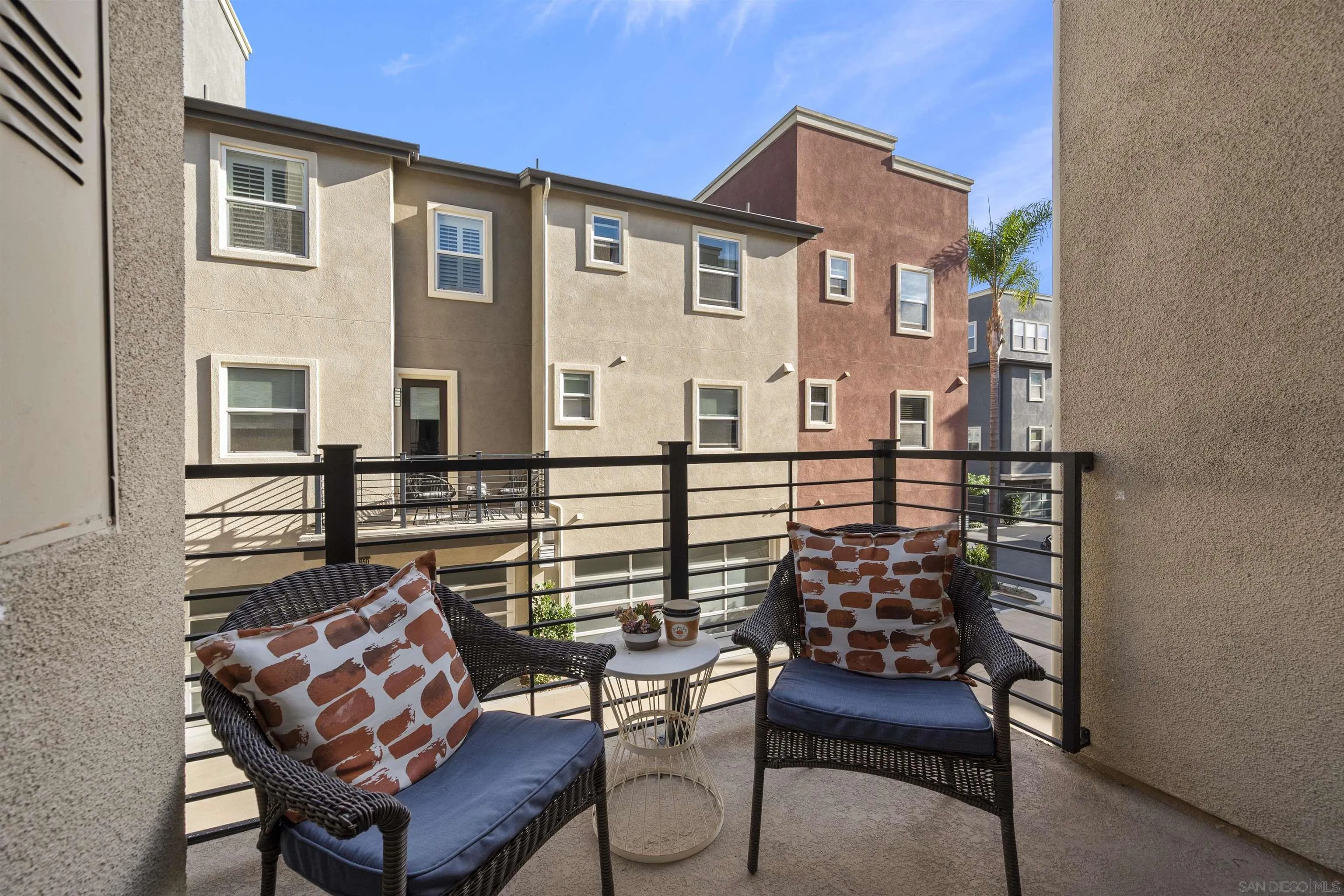 7834 Inception Way San Diego, CA 92108 - Photo 19 of 62 a front view of a house with outdoor seating