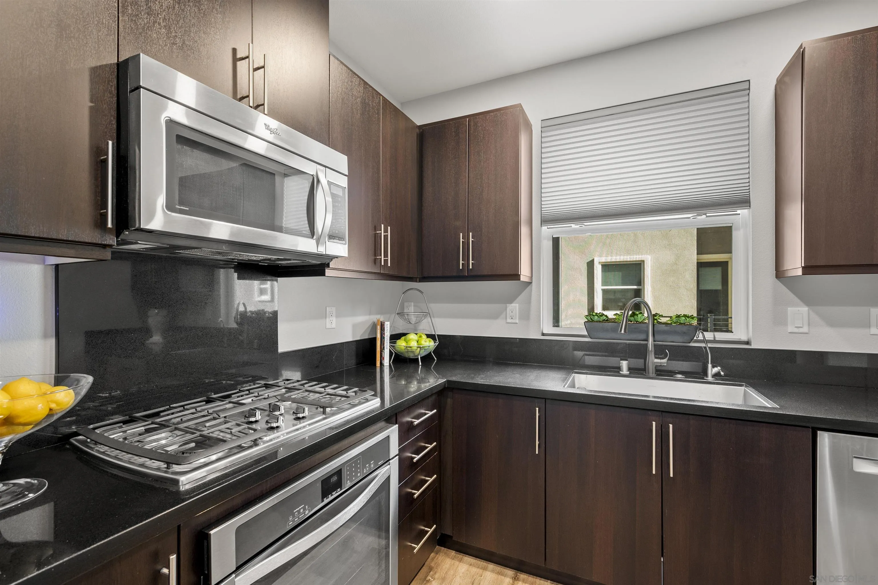 7834 Inception Way San Diego, CA 92108 - Photo 22 of 62 a kitchen with a stove and a microwave