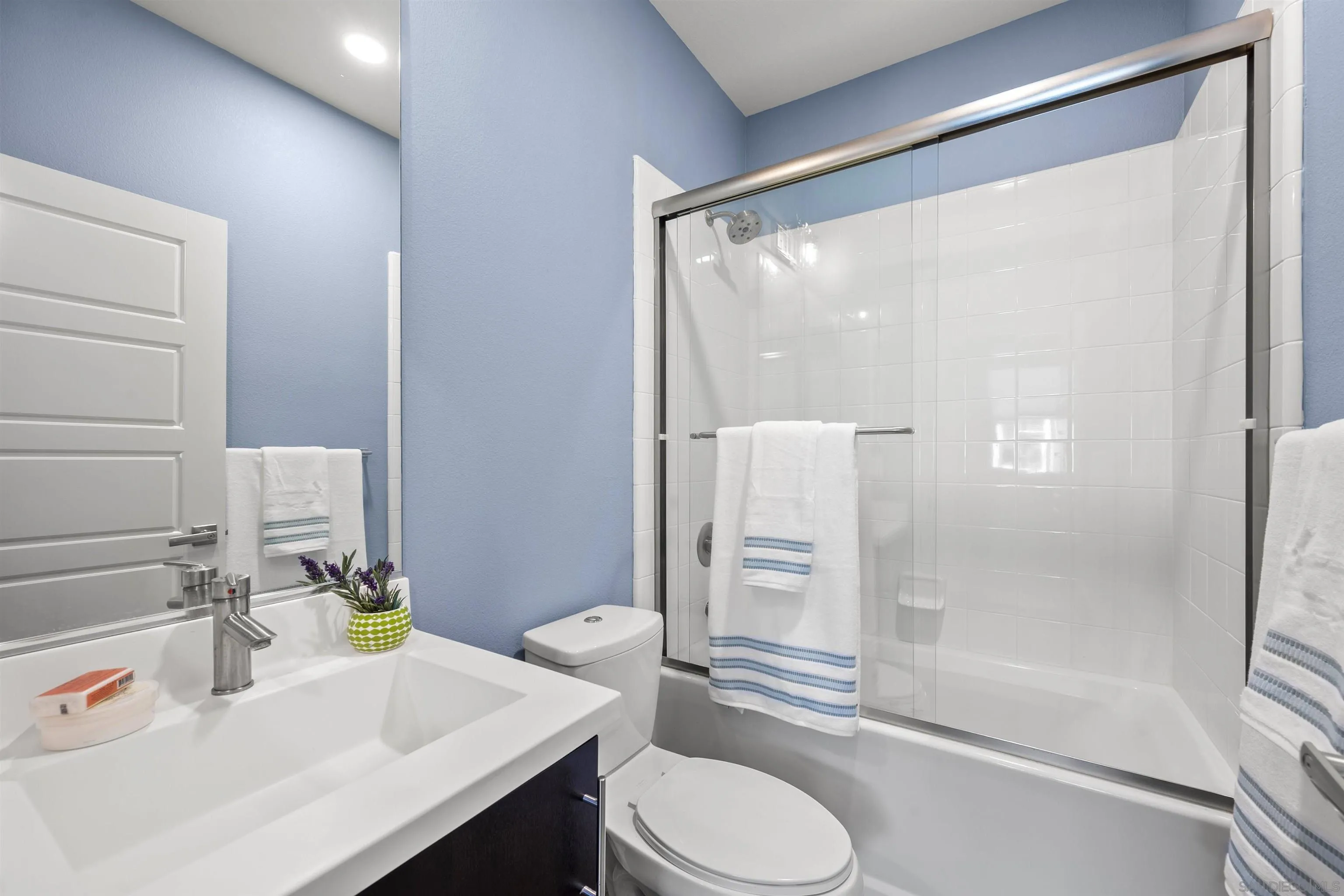 7834 Inception Way San Diego, CA 92108 - Photo 30 of 62 a bathroom with a sink toilet and shower