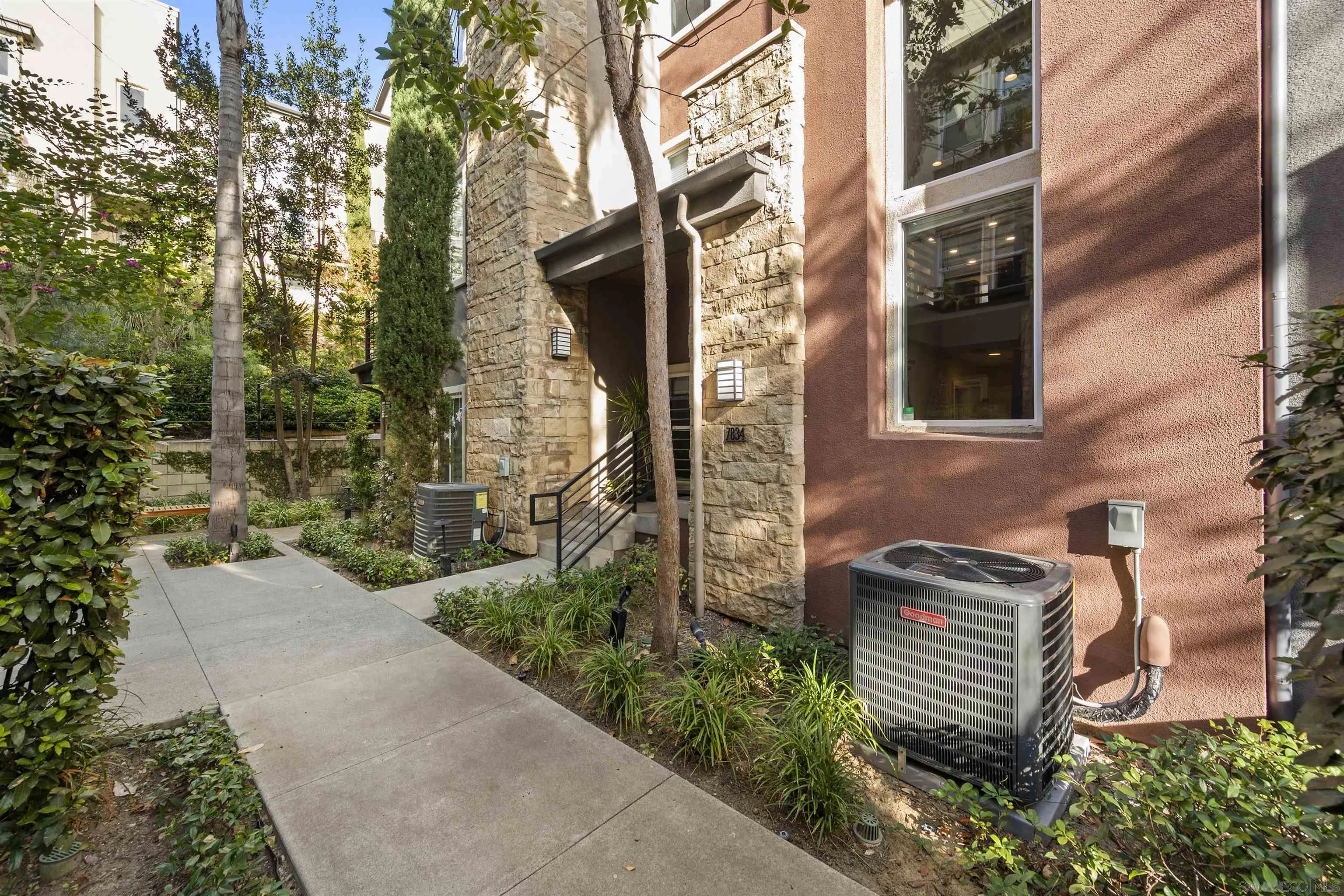 7834 Inception Way San Diego, CA 92108 - Photo 3 of 62 a backyard of a house with lots of green space