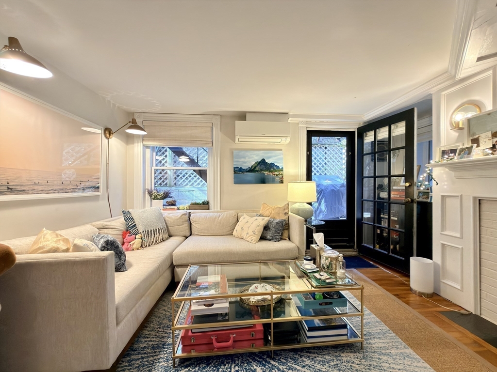 41 Pinckney Street, Unit B Boston, MA 02114 - Photo 21 of 31 a living room with furniture and a large window