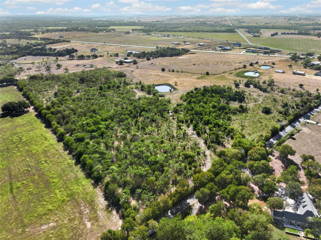 0 Novy Road Ennis, TX 75119 - Photo 2 of 25 Expansive acreage featuring established tree coverage and multiple water features