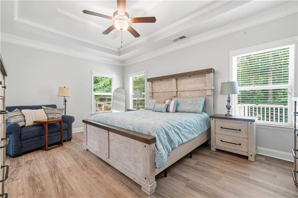 302 Spence Circle Ball Ground, GA 30107 - Photo 23 of 55 a bedroom with a bed and a large window