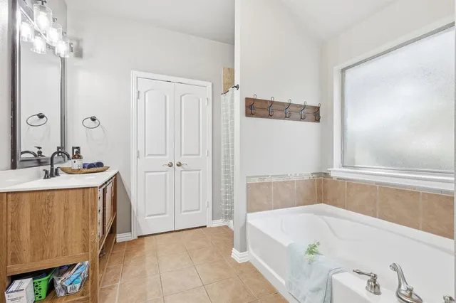 a room with a sink and a mirror