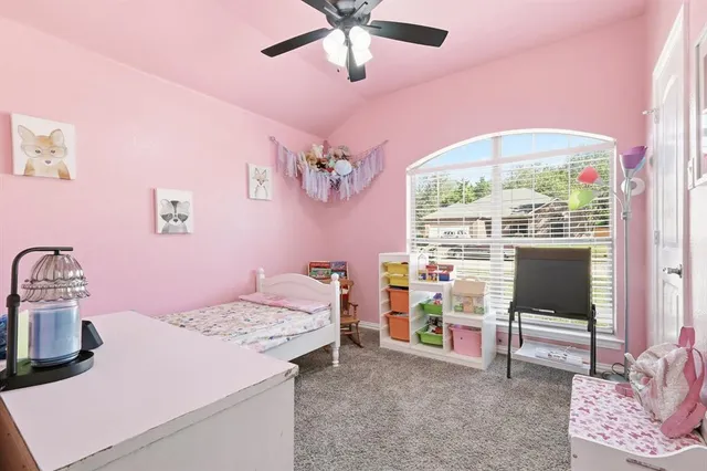 a bathroom with a granite countertop sink a toilet and a mirror