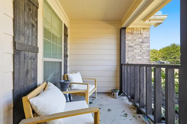 a aerial view of a house next to a big yard and large trees