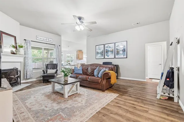 a living room with furniture and a fireplace