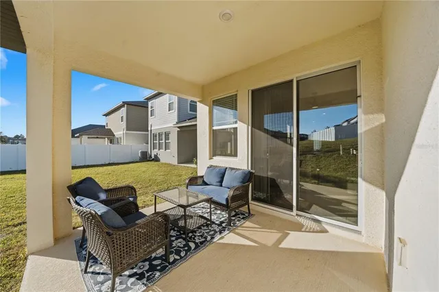 a view of balcony with furniture
