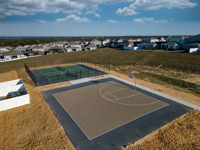a view of a swimming pool with a yard