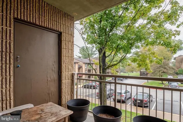 a view of balcony with a potted plant