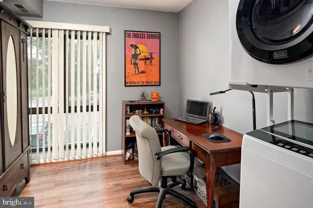 a work room with furniture and a window