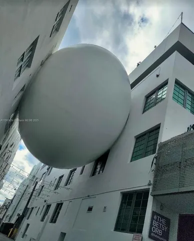 a view of a street with a building in the background