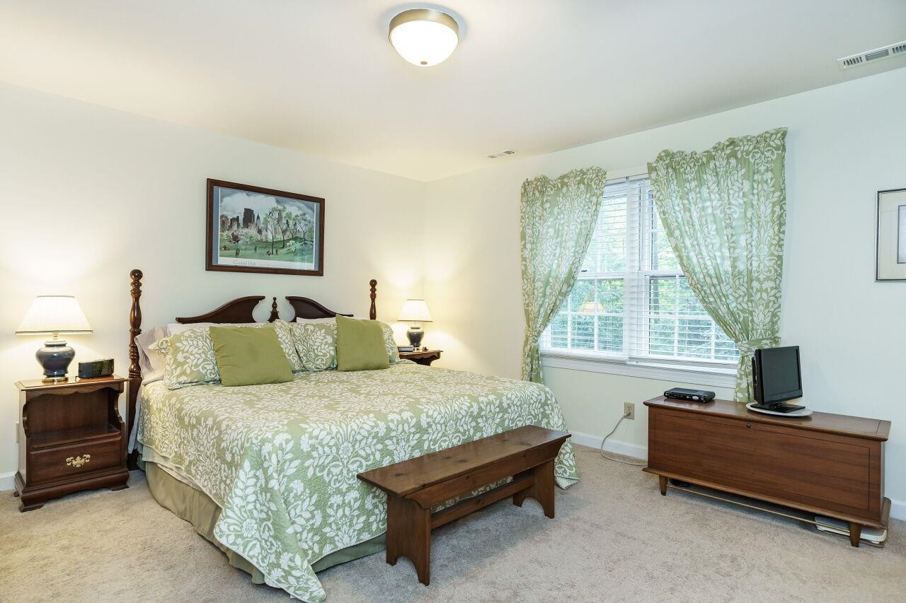 8116 Calais Court Raleigh, NC 27613 - Photo 18 of 33 Spacious room with access to primary bath Primary Bedroom