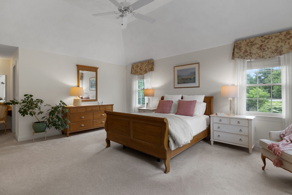4 Coderre Way Andover, MA 01810 - Photo 20 of 35 a spacious bedroom with a bed and a window