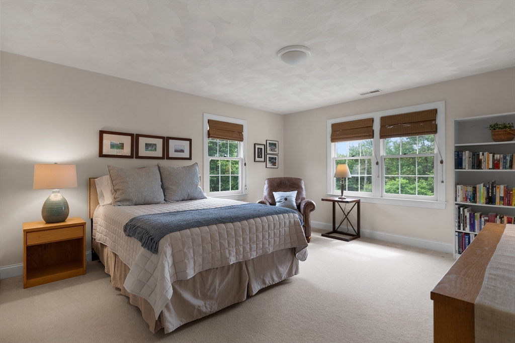 4 Coderre Way Andover, MA 01810 - Photo 23 of 35 a spacious bedroom with a bed and a large window