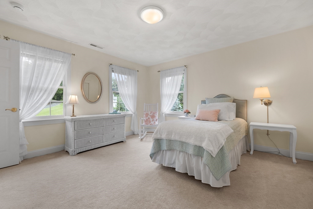 4 Coderre Way Andover, MA 01810 - Photo 24 of 35 a bedroom with a bed and a dresser