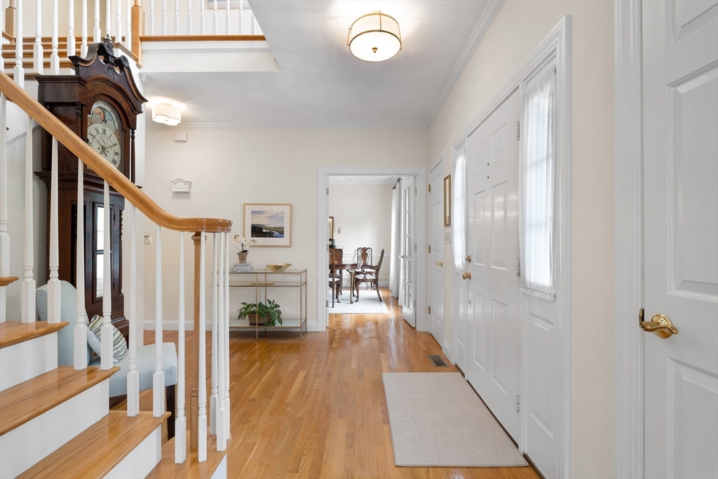 4 Coderre Way Andover, MA 01810 - Photo 3 of 35 a view of a hallway with wooden floor and staircase