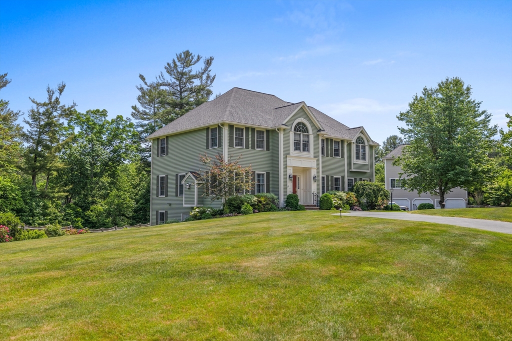 4 Coderre Way Andover, MA 01810 - Photo 35 of 35 a front view of a house with a garden