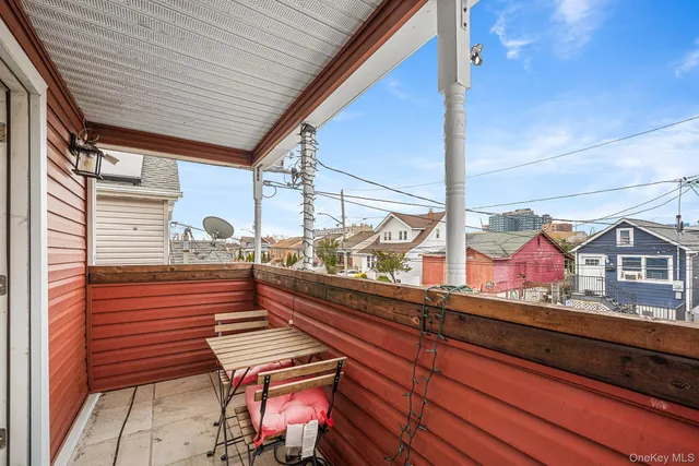 a view of a two chairs in the balcony