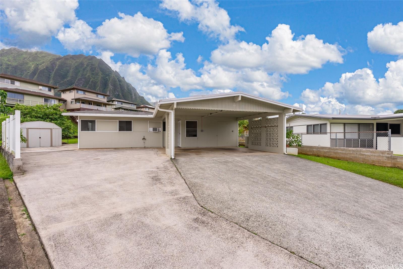 45-552 Anoi Road Kaneohe, HI 96744 - Photo 1 of 1 a view of a house with a backyard and a garage
