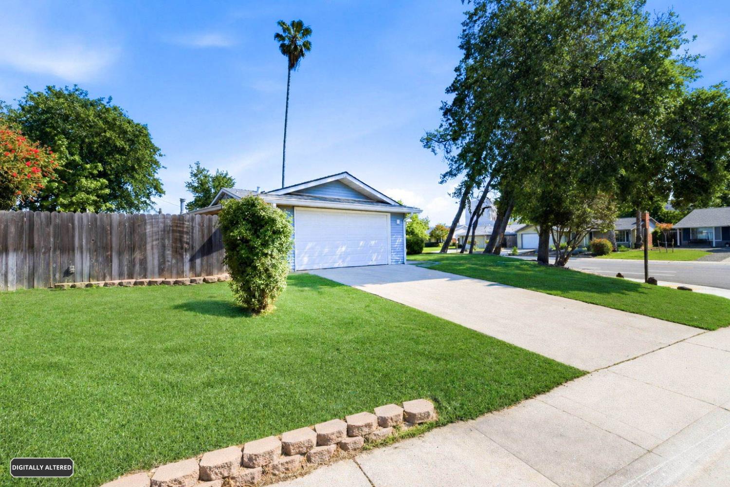 6353 Edgerton Way Carmichael, CA 95608 - Photo 4 of 21 a front view of a house with garden