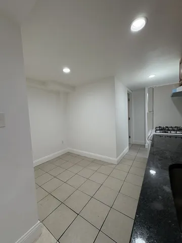 a kitchen with a sink cabinets and appliances