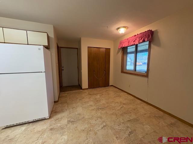 120 Camino Del Rio, Unit 35 Gunnison, CO 81230 - Photo 13 of 32 a view of empty room with a kitchen