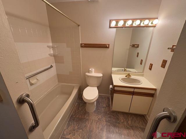 120 Camino Del Rio, Unit 35 Gunnison, CO 81230 - Photo 16 of 32 a bathroom with a toilet sink and mirror