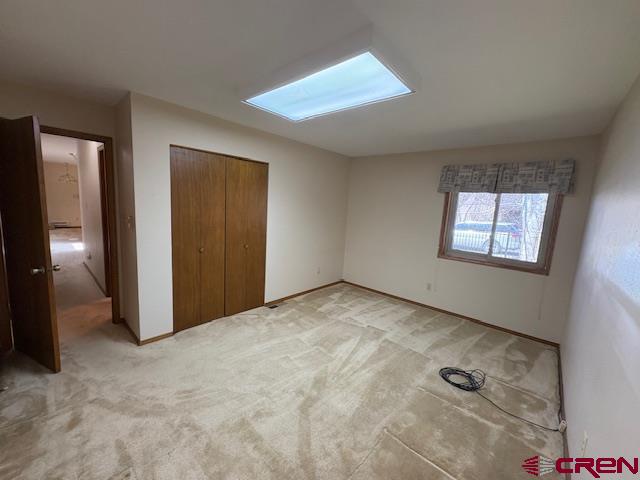 120 Camino Del Rio, Unit 35 Gunnison, CO 81230 - Photo 24 of 32 an empty room with windows and closet