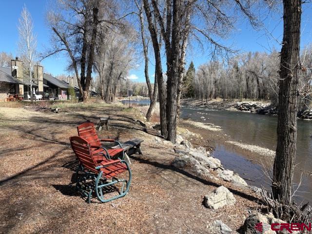 120 Camino Del Rio, Unit 35 Gunnison, CO 81230 - Photo 30 of 32 a view of a lake with a tree