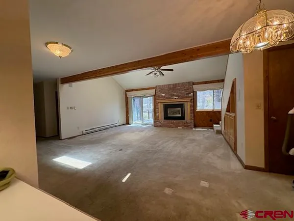 a view of a kitchen with a sink and cabinets