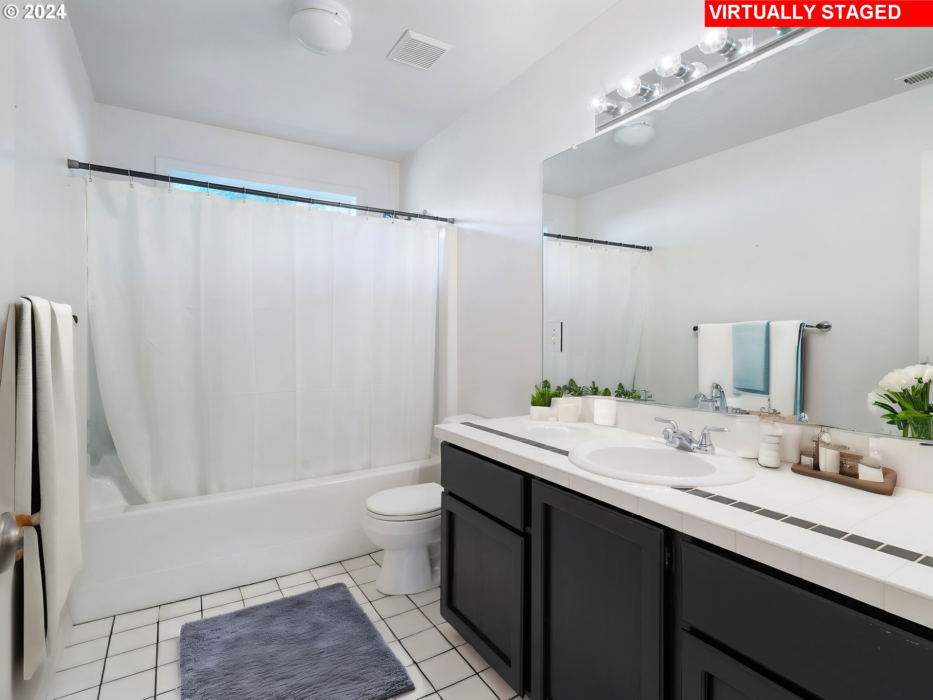 3209 Southwest Talbot Road Portland, OR 97201 - Photo 19 of 35 a bathroom with a double vanity sink toilet and shower