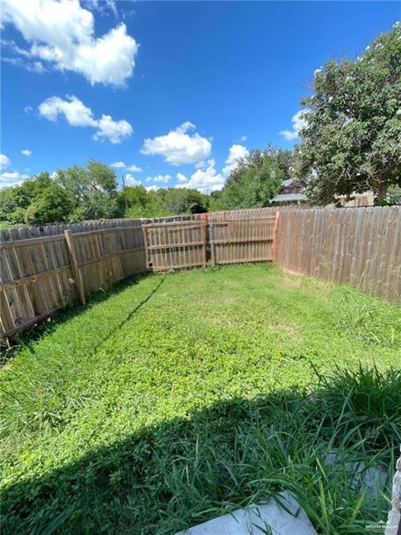 1017 East Tom Landry Street, Unit 17 Mission, TX 78572 - Photo 9 of 10 a view of a yard with wooden fence