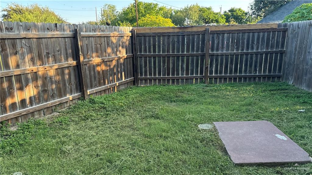 1017 East Tom Landry Street, Unit 17 Mission, TX 78572 - Photo 10 of 10 a view of a backyard with a fence