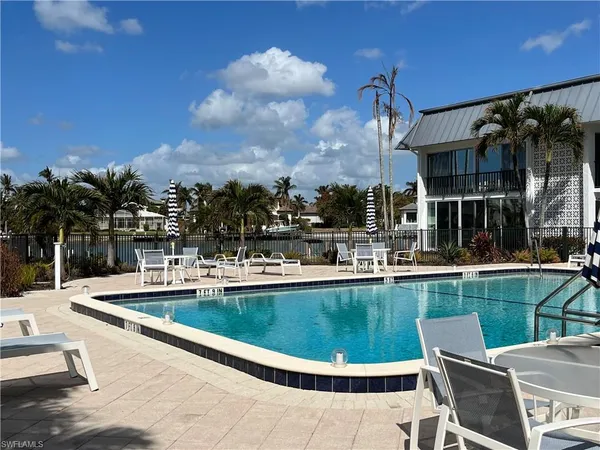 a view of a swimming pool with a patio